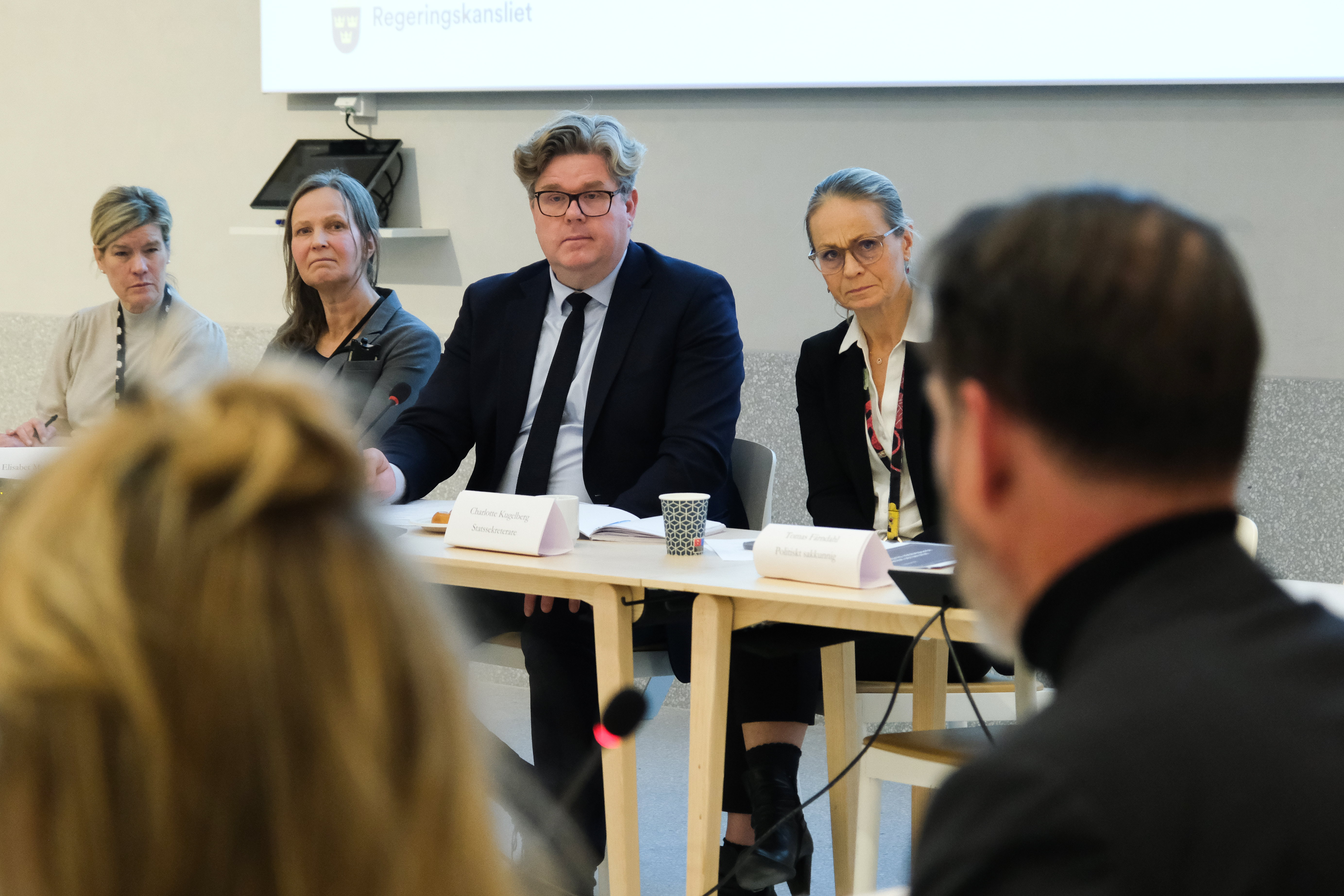 Minister for Justice Gunnar Strömmer and State Secretary Charlotte Kugelberg with ministry officials.
