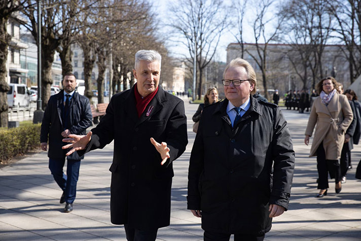 To the left Artis Pabriks and to the right Peter Hultqvist walking outside in Riga.