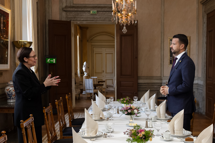 Maria Malmer Stenergard and President of Montenegro Jakov Milatović talking to each other at a table.