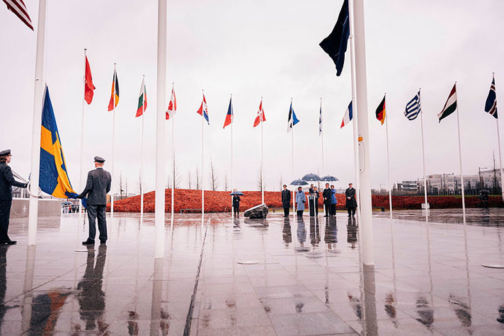 The Swedish flag is raised at NATO headquarters in Brussels.